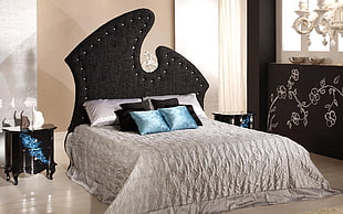 black fabric headboard bed with gray bedspread